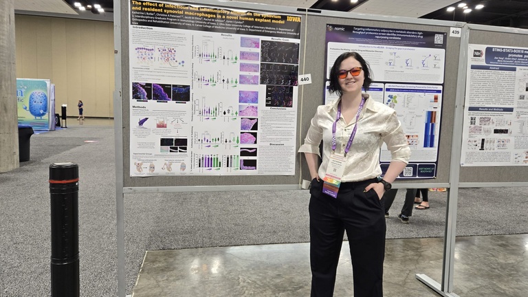 KB Butler presenting her poster at AAI 2025